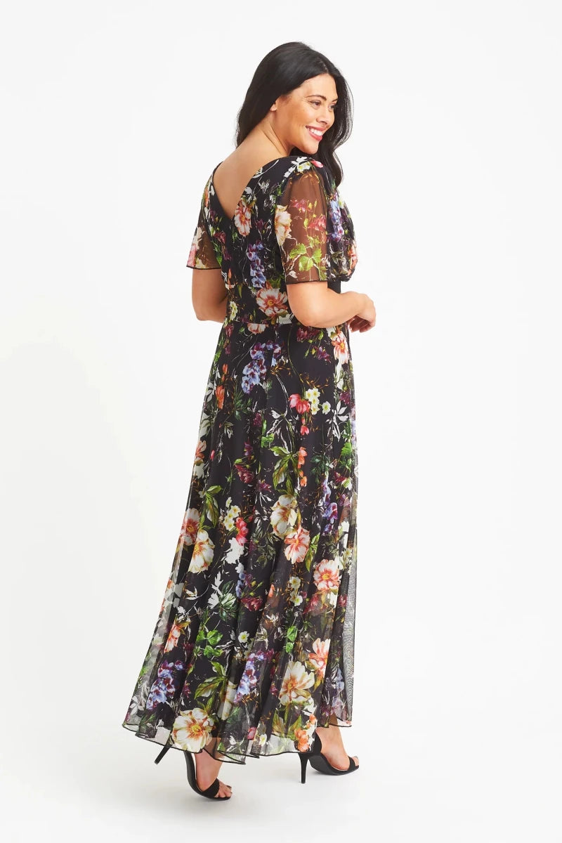 Scarlett & Jo Isabelle Black Terra floral maxi dress showing the V-shaped back, sheer float sleeves and flowing floral skirt.