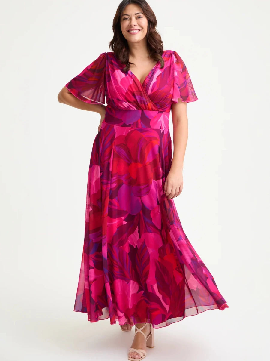 Isabelle cerise purple floral maxi dress by Scarlett &amp; Jo featuring a wrap V-neckline, sheer angel sleeves and flowing skirt.