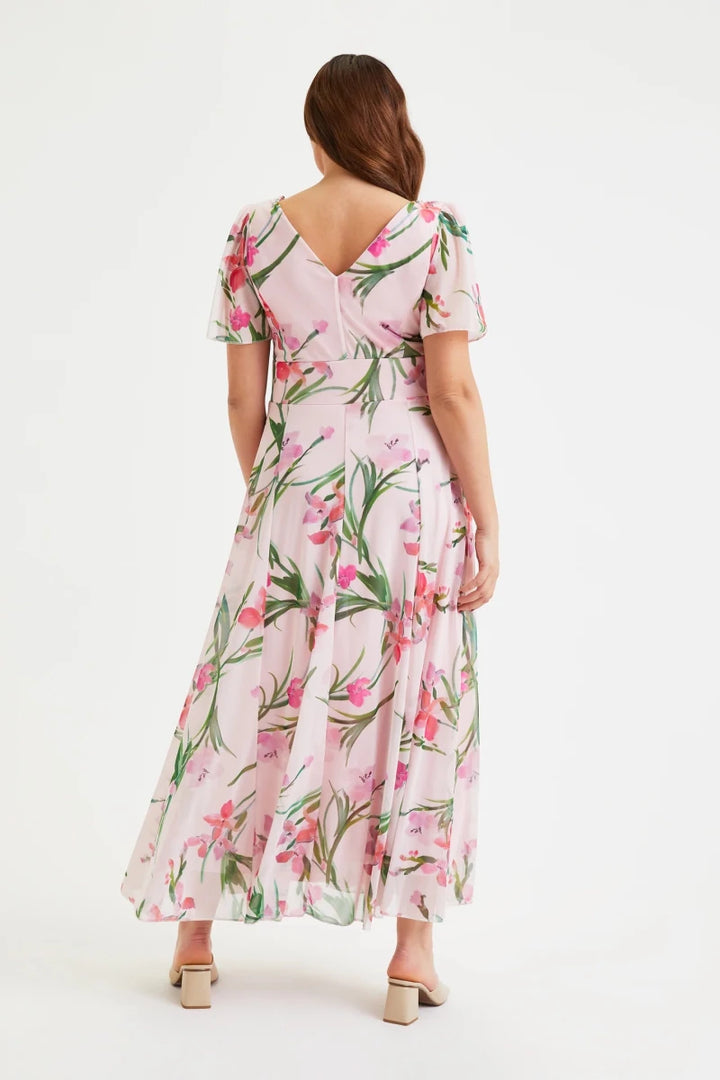 Back view of Scarlett &amp; Jo Isabelle Pink Floral Maxi Dress showing the V-shaped back neckline, sheer angel sleeves and softly flared floral skirt.